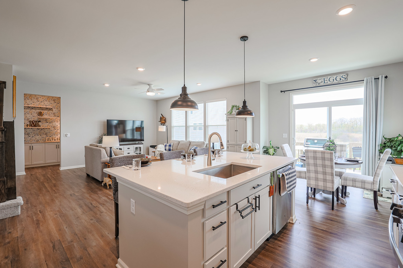 216 North Barry Road South Elgin, IL 60177 - Photo 9 of 50 a open kitchen with stainless steel appliances granite countertop a sink a stove and wooden floor