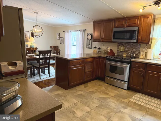 a large kitchen with cabinets and furniture