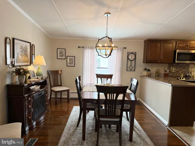 a dining room with furniture window wooden floor