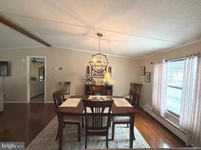 a kitchen with stainless steel appliances granite countertop a refrigerator stove and sink