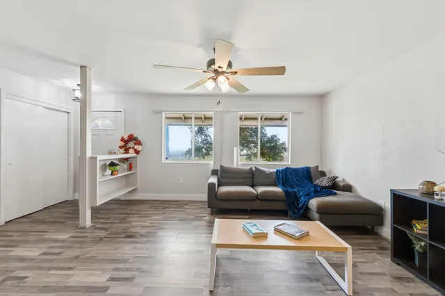 a living room with furniture and a window