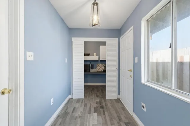 a view of bedroom with wooden floor