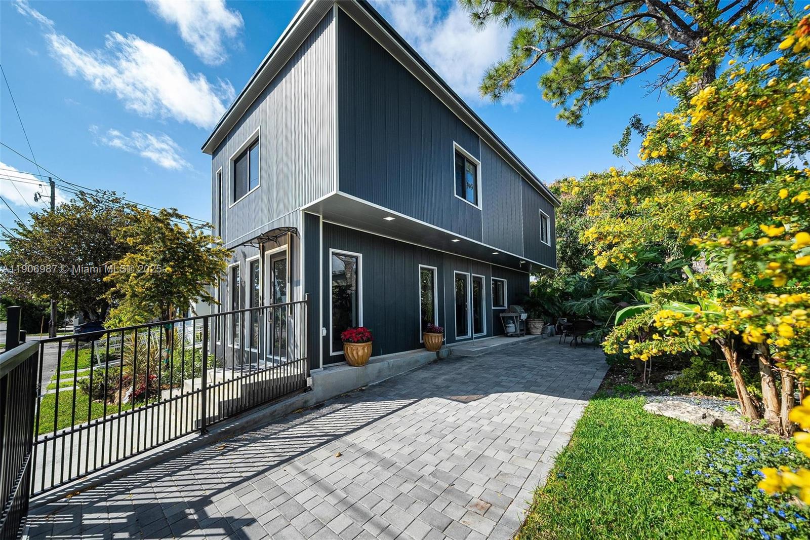 a view of a house with a flower garden