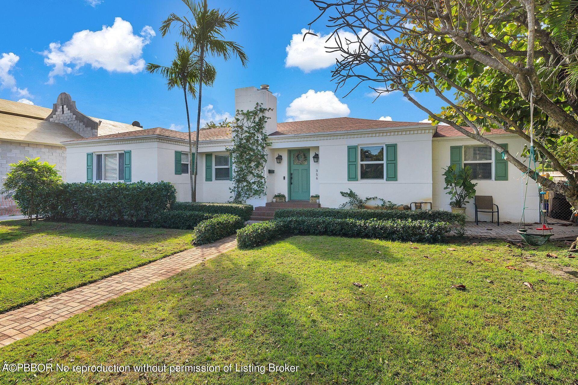 356 Potter Road West Palm Beach, FL 33405 - Photo 1 of 24 a front view of a house with garden