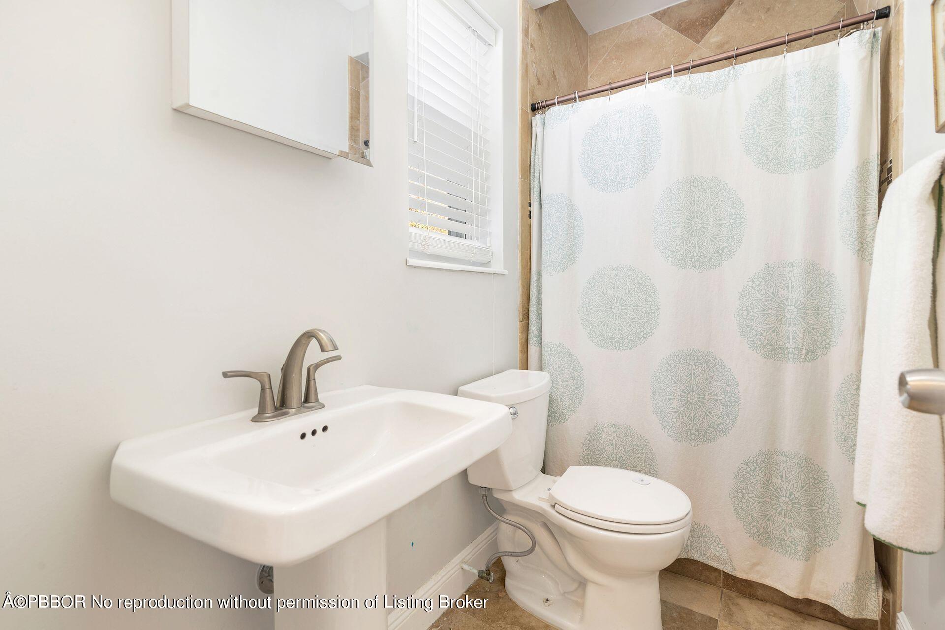 356 Potter Road West Palm Beach, FL 33405 - Photo 16 of 24 a bathroom with a sink toilet and shower