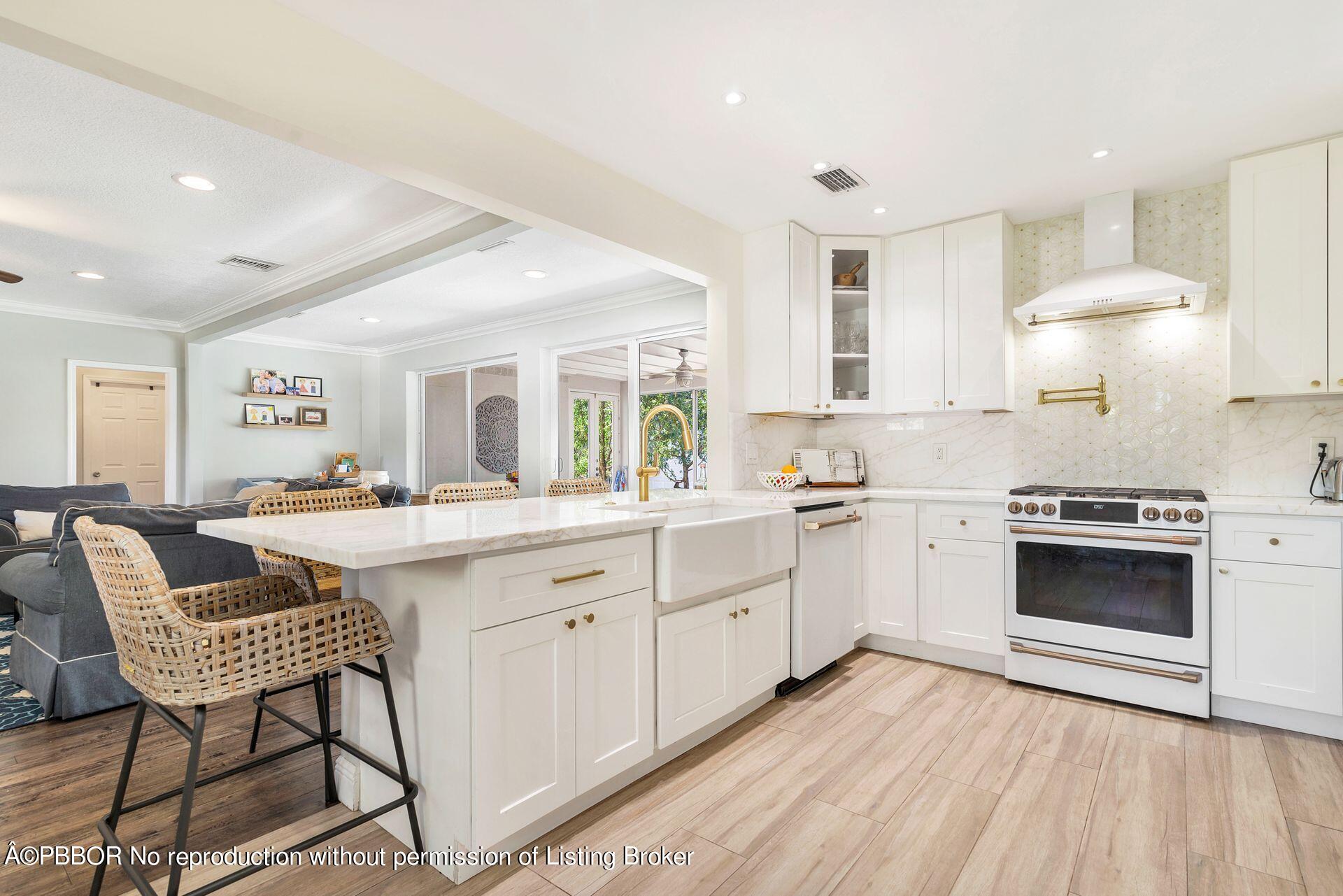 356 Potter Road West Palm Beach, FL 33405 - Photo 9 of 24 a kitchen with cabinets a sink and appliances