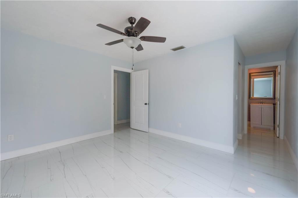 2207 Lily Road Fort Myers, FL 33905 - Photo 8 of 16 Unfurnished room featuring ceiling fan