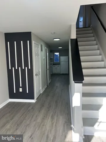 a view of entryway with wooden floor