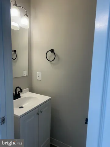 a bathroom with a sink and mirror