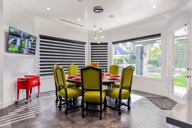 a view of a dining room with furniture and window