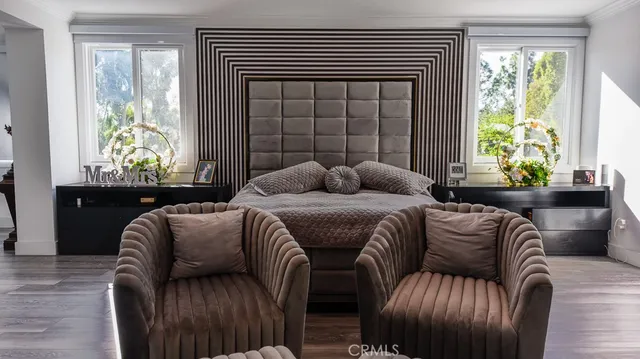 a bedroom with furniture and a window