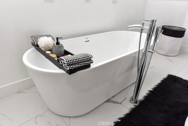 a white bath tub sitting in a bathroom
