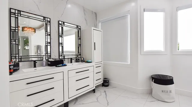 a bathroom with a double vanity sink mirror bathtub and toilet