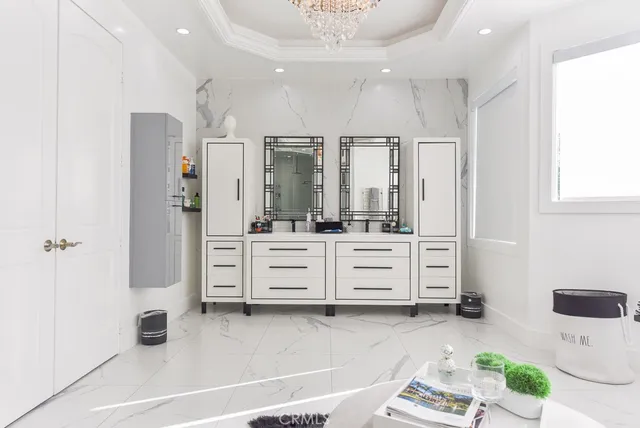 a bathroom with a double vanity sink mirror and shower