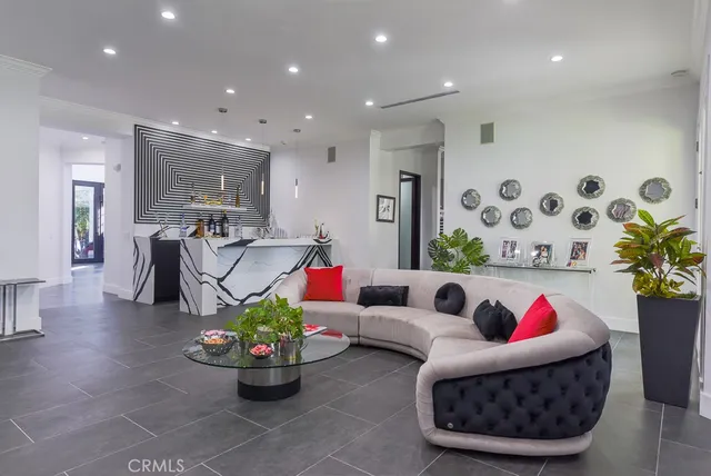 a living room with furniture and flowers