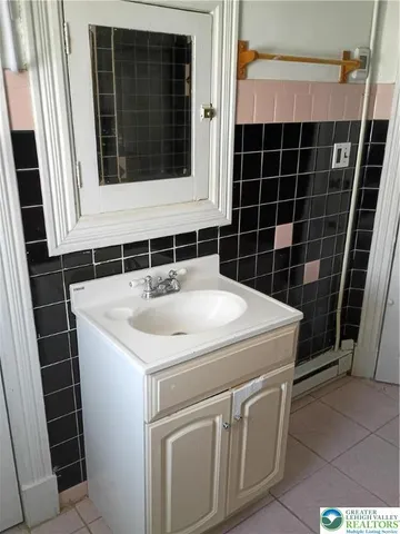 a bathroom with a sink and a washing machine