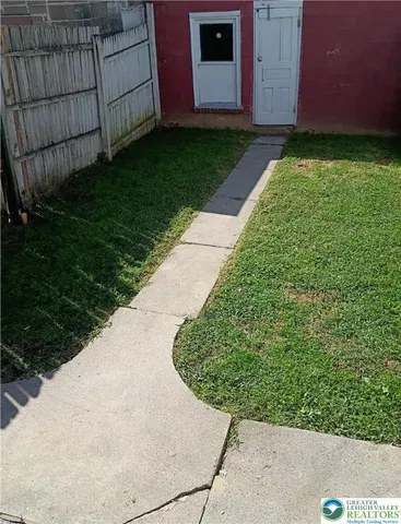 a view of a garage with rack and bicycle