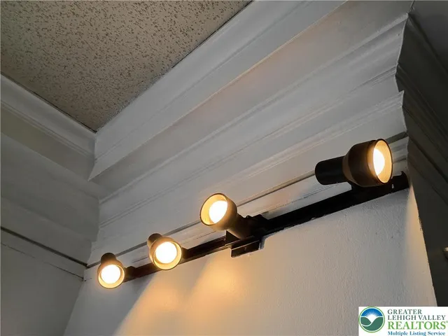 a view of a dry yard with wooden fence