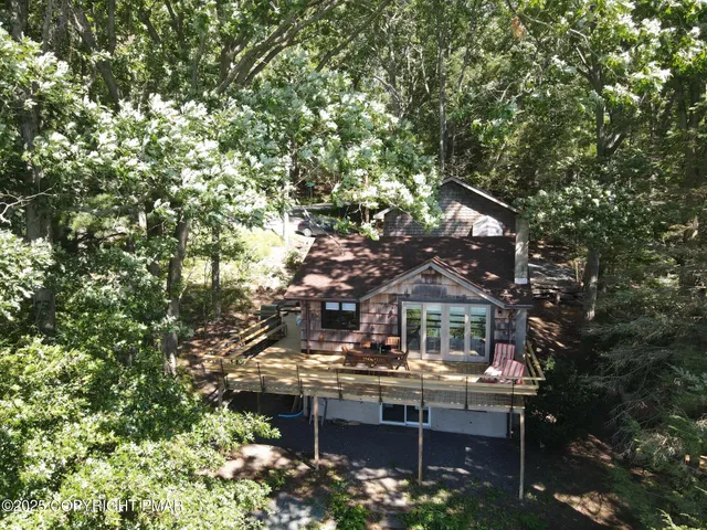 a house view with a sitting space and garden space
