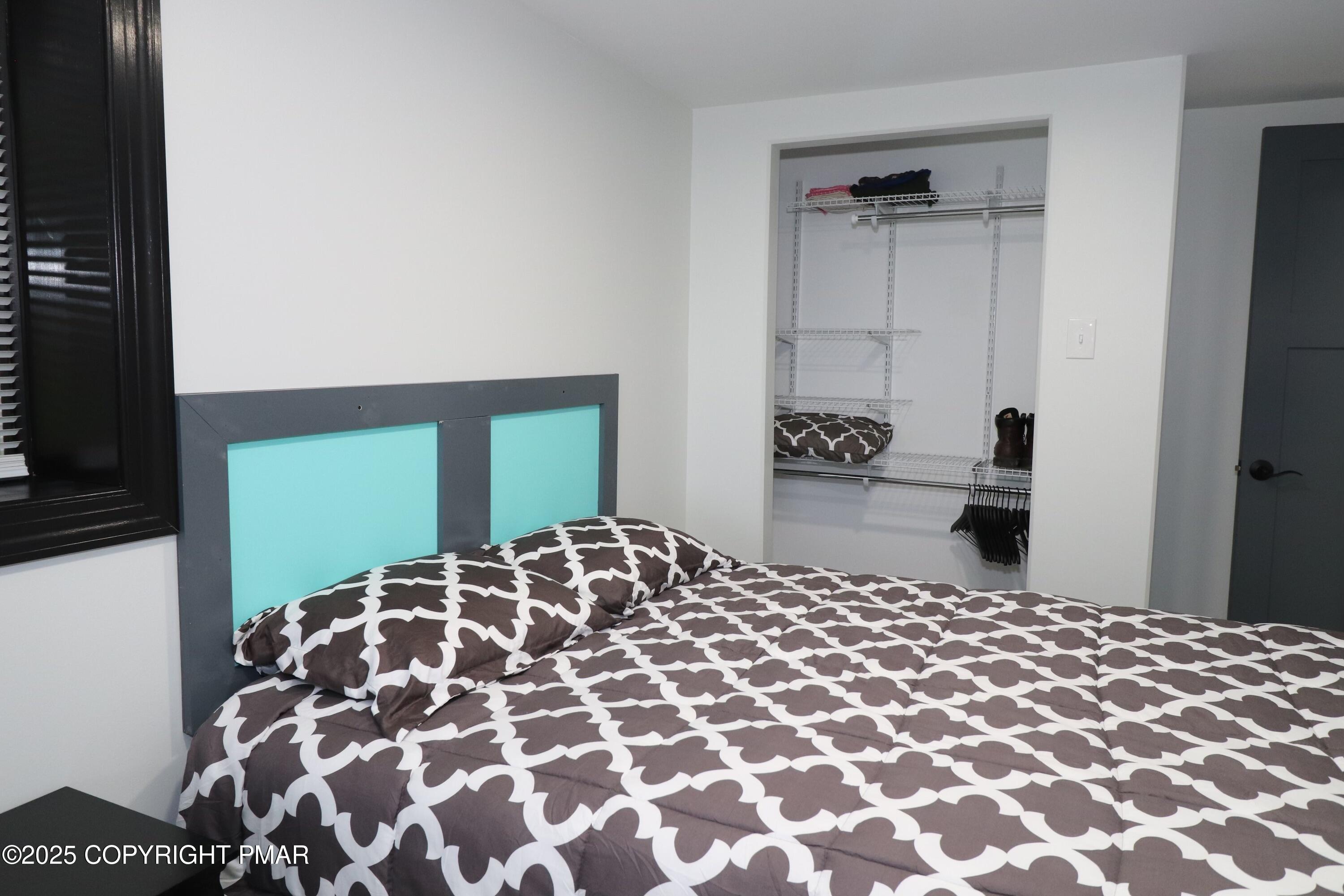 101 Antler Rdg Court Hawley, PA 18428 - Photo 36 of 36 a bedroom with a bed and wooden floor