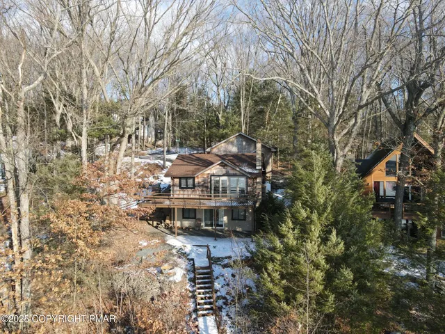 a view of house with backyard space and garden