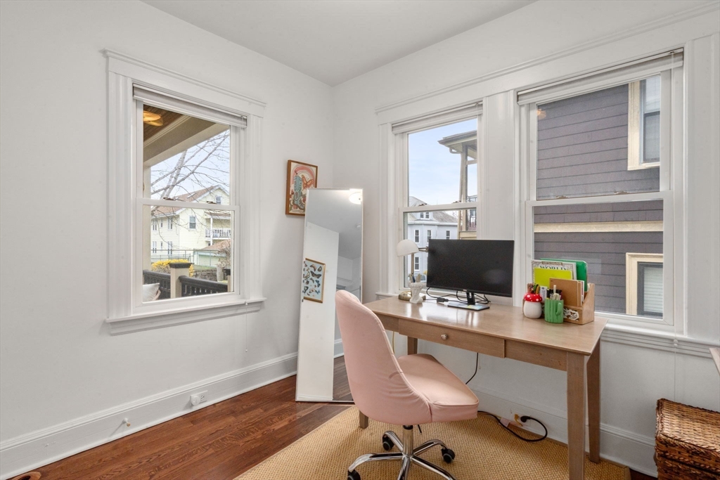 35-37 Presentation Road Boston, MA 02135 - Photo 13 of 29 a view of a workspace with furniture and a window