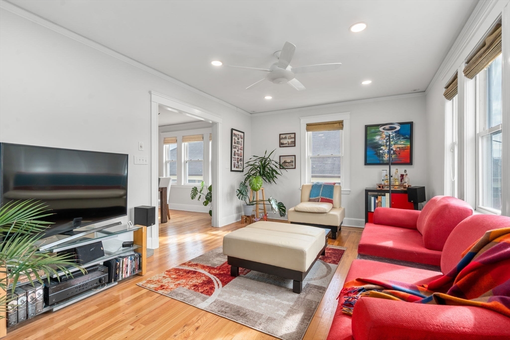 35-37 Presentation Road Boston, MA 02135 - Photo 15 of 29 a living room with furniture and a flat screen tv