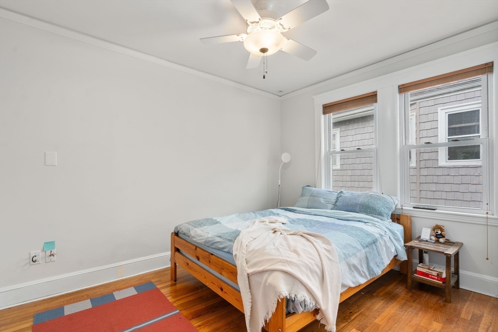 35-37 Presentation Road Boston, MA 02135 - Photo 22 of 29 a bedroom with a bed and a window