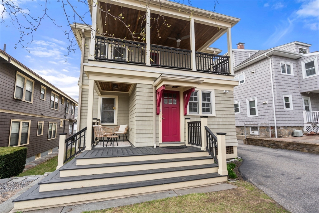 35-37 Presentation Road Boston, MA 02135 - Photo 27 of 29 a view of a house with a balcony and large windows