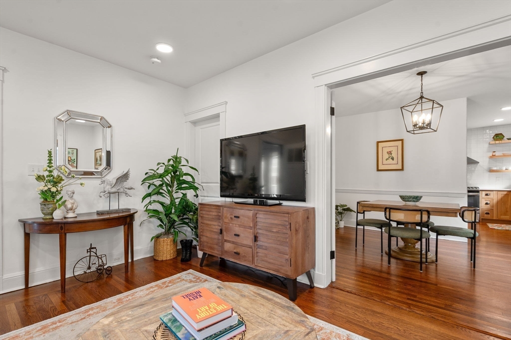 35-37 Presentation Road Boston, MA 02135 - Photo 5 of 29 a living room with furniture and a flat screen tv