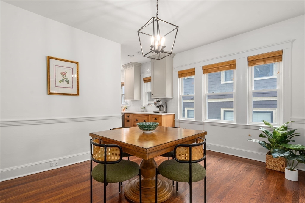 35-37 Presentation Road Boston, MA 02135 - Photo 7 of 29 a view of a dining room with furniture wooden floor and chandelier