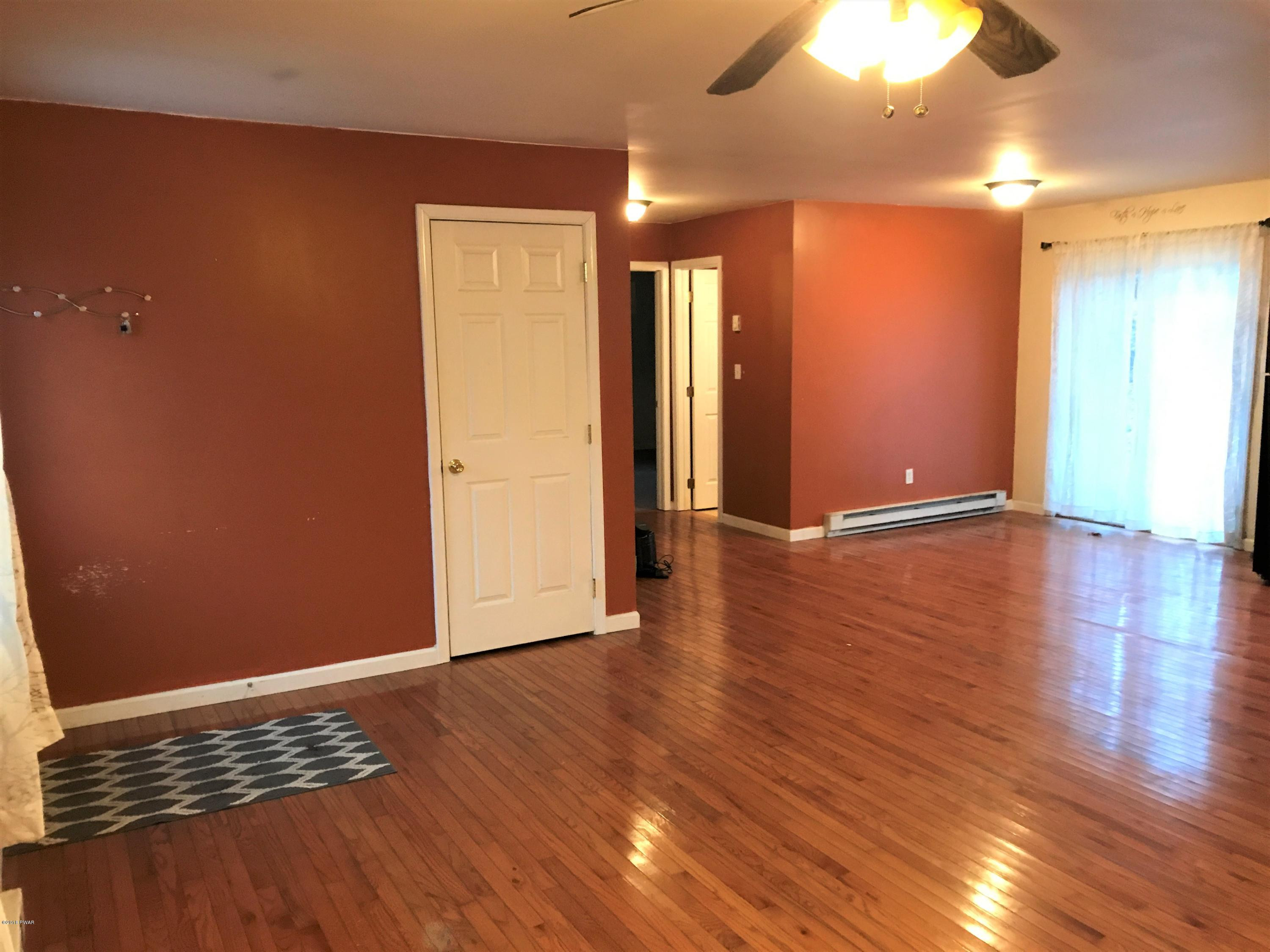 151 Raccoon Road Dingmans Ferry, PA 18328 - Photo 11 of 29 a view of room with wooden floor and window