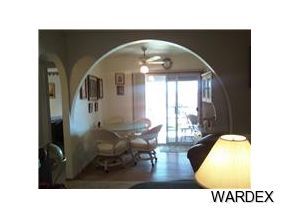 149807 Modoc Way Big River, CA 92242 - Photo 3 of 4 a living room with furniture and a large window