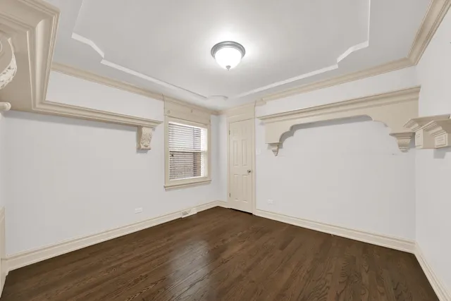 a view of a livingroom with wooden floor and a window