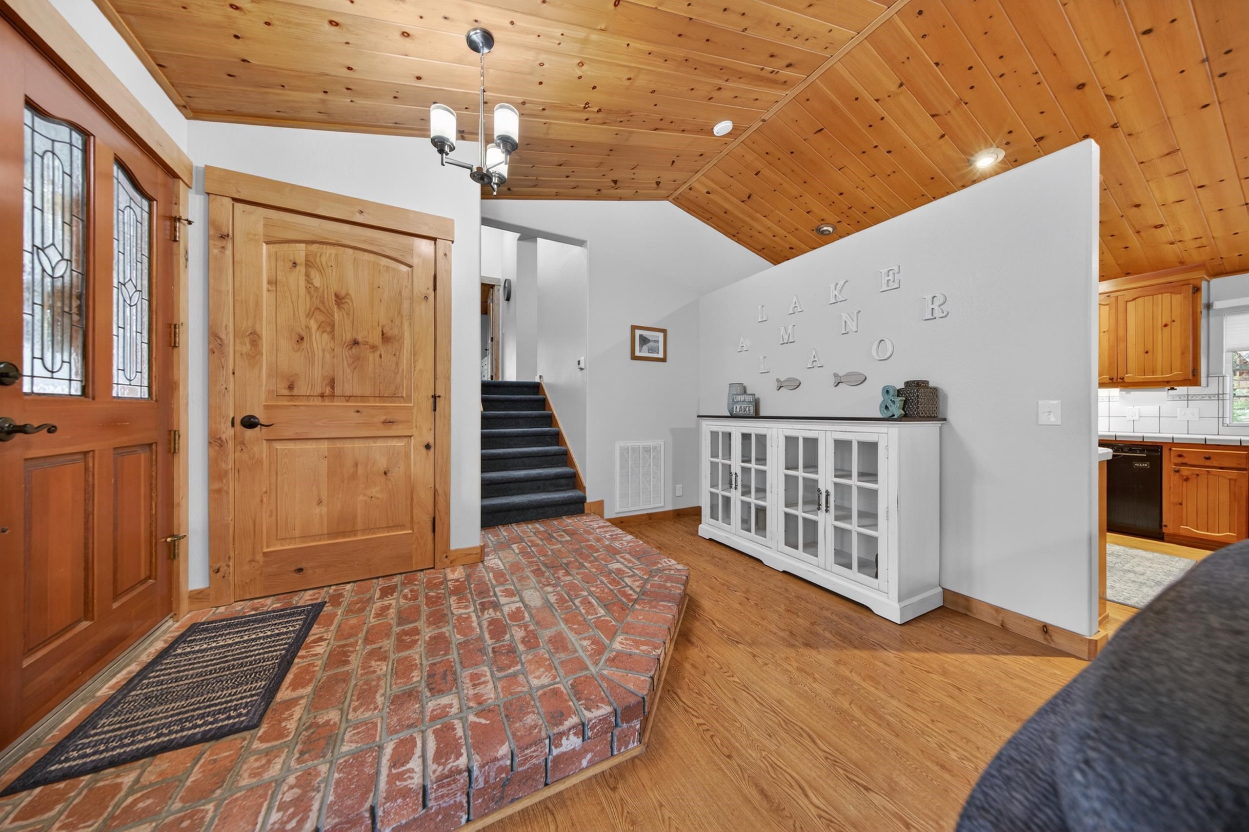 1220 Lynx Road Lake Almanor, CA 96137 - Photo 7 of 45 a view of a hallway with wooden floor and staircase
