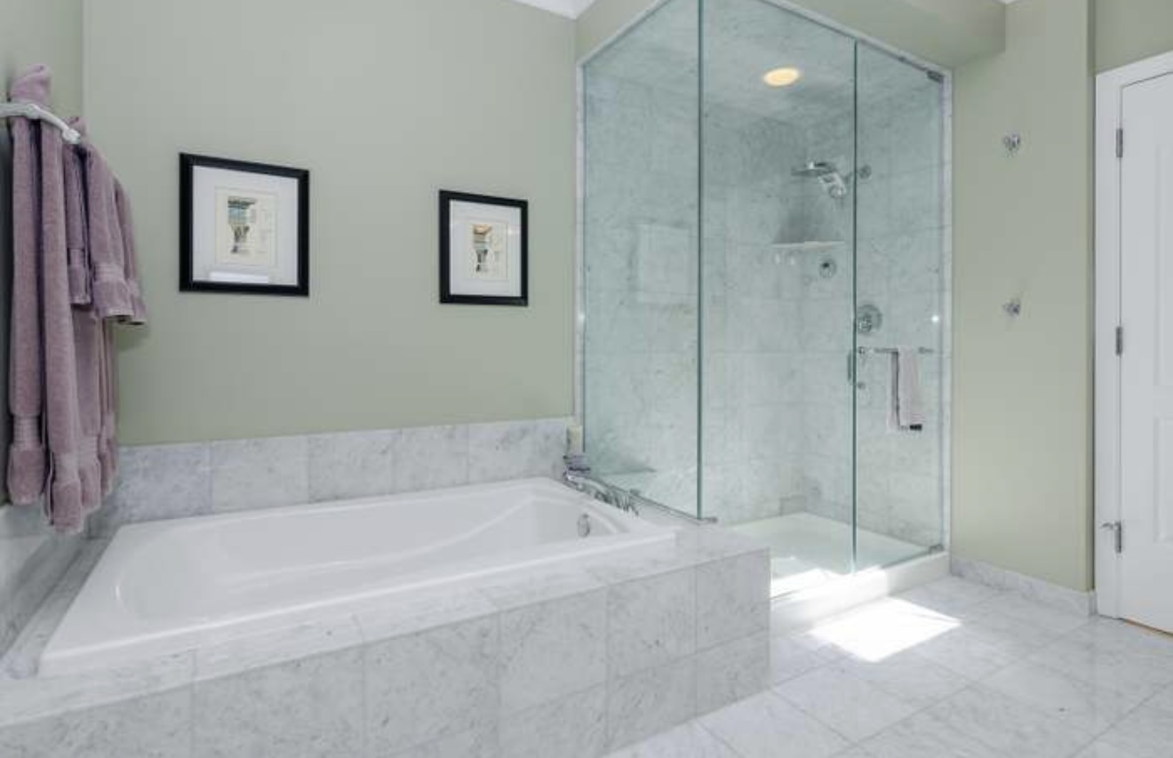 1125 West Monroe Street Chicago, IL 60607 - Photo 16 of 49 a bathroom with a bathtub and a shower