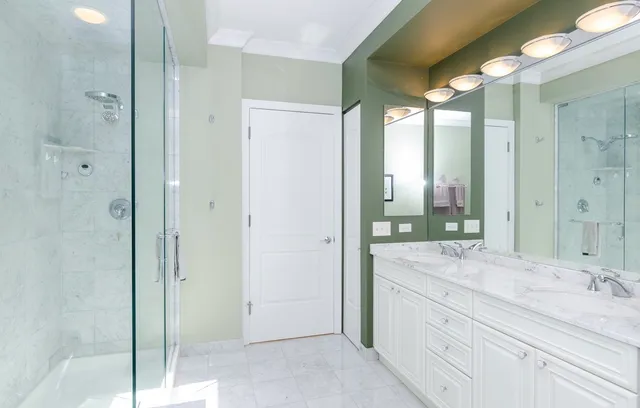 a bathroom with a granite countertop sink mirror and double