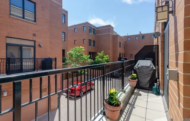 a view of a balcony with potted plants