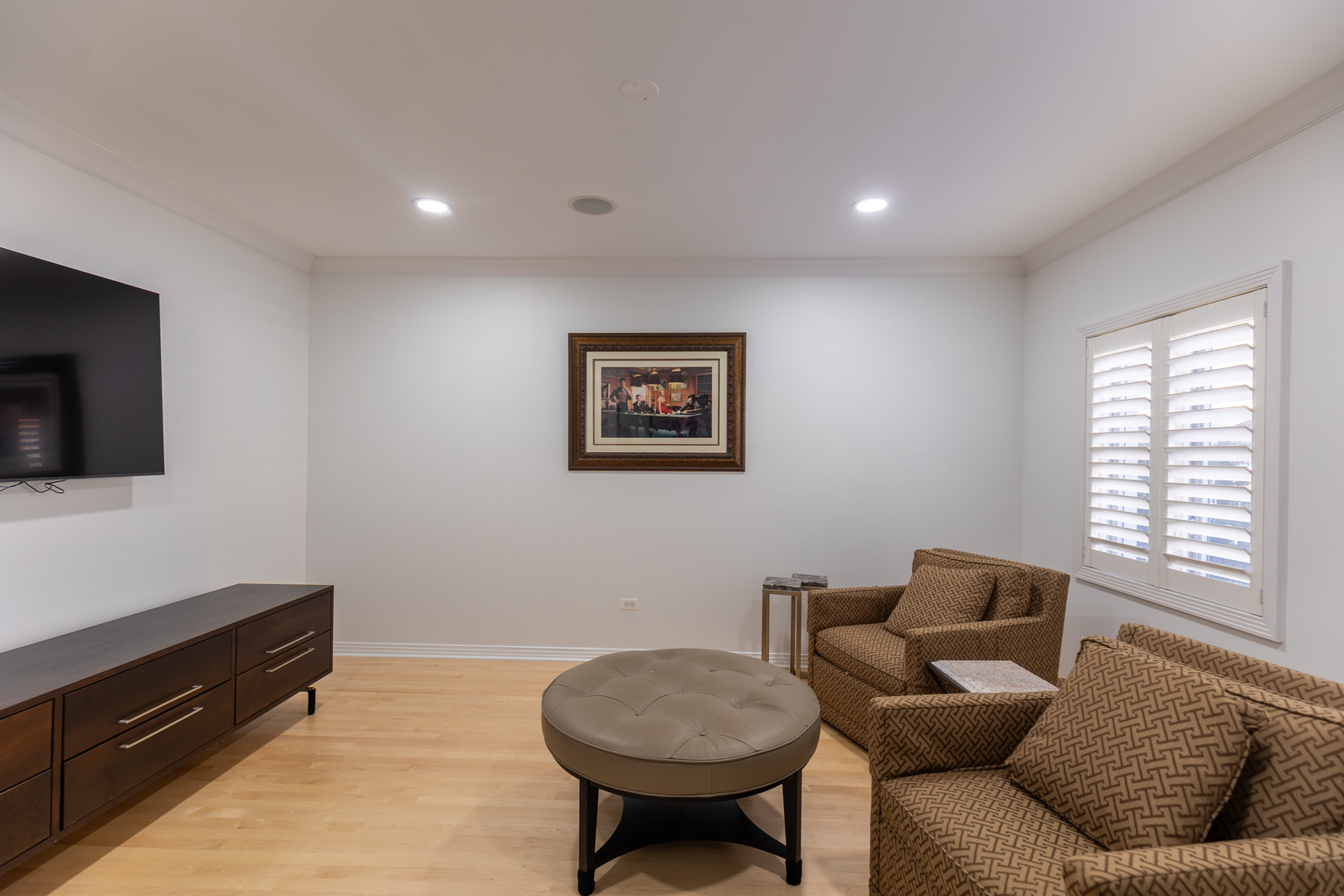 1125 West Monroe Street Chicago, IL 60607 - Photo 35 of 49 a living room with furniture a flat screen tv and a window