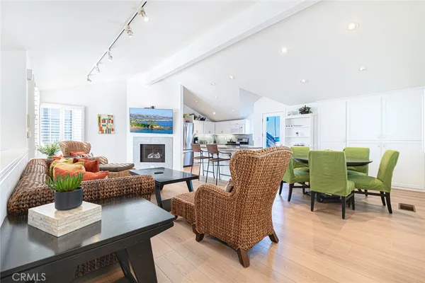 a living room with fireplace furniture and a wooden floor