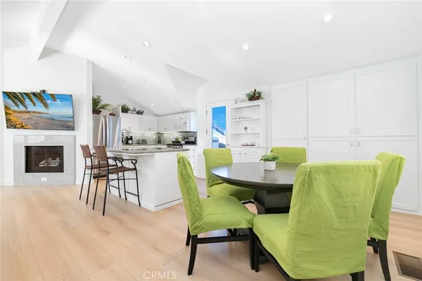 a dining room with furniture and a fireplace