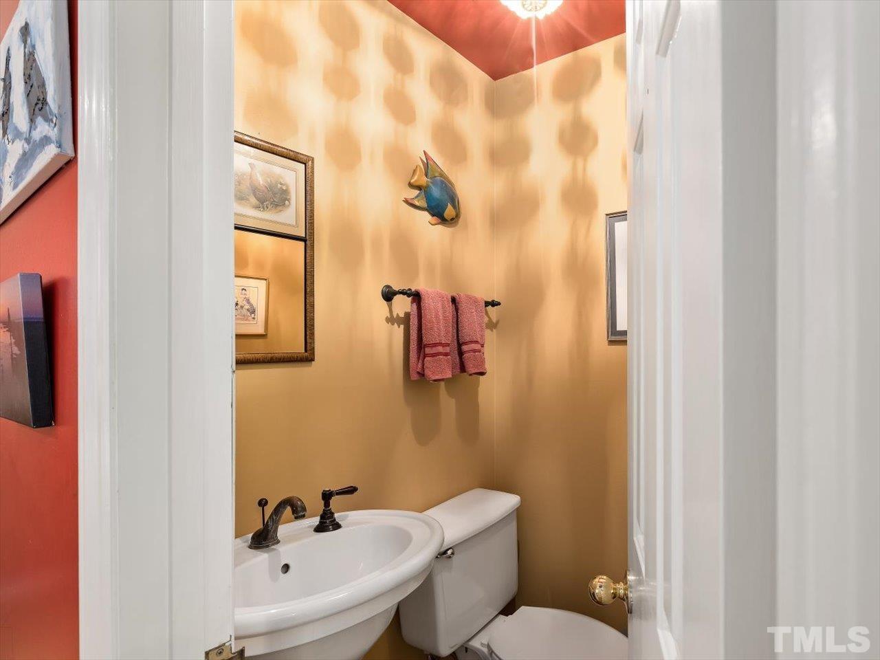 2868 Wycliff Road Raleigh, NC 27607 - Photo 11 of 28 a bathroom with a sink mirror and toilet