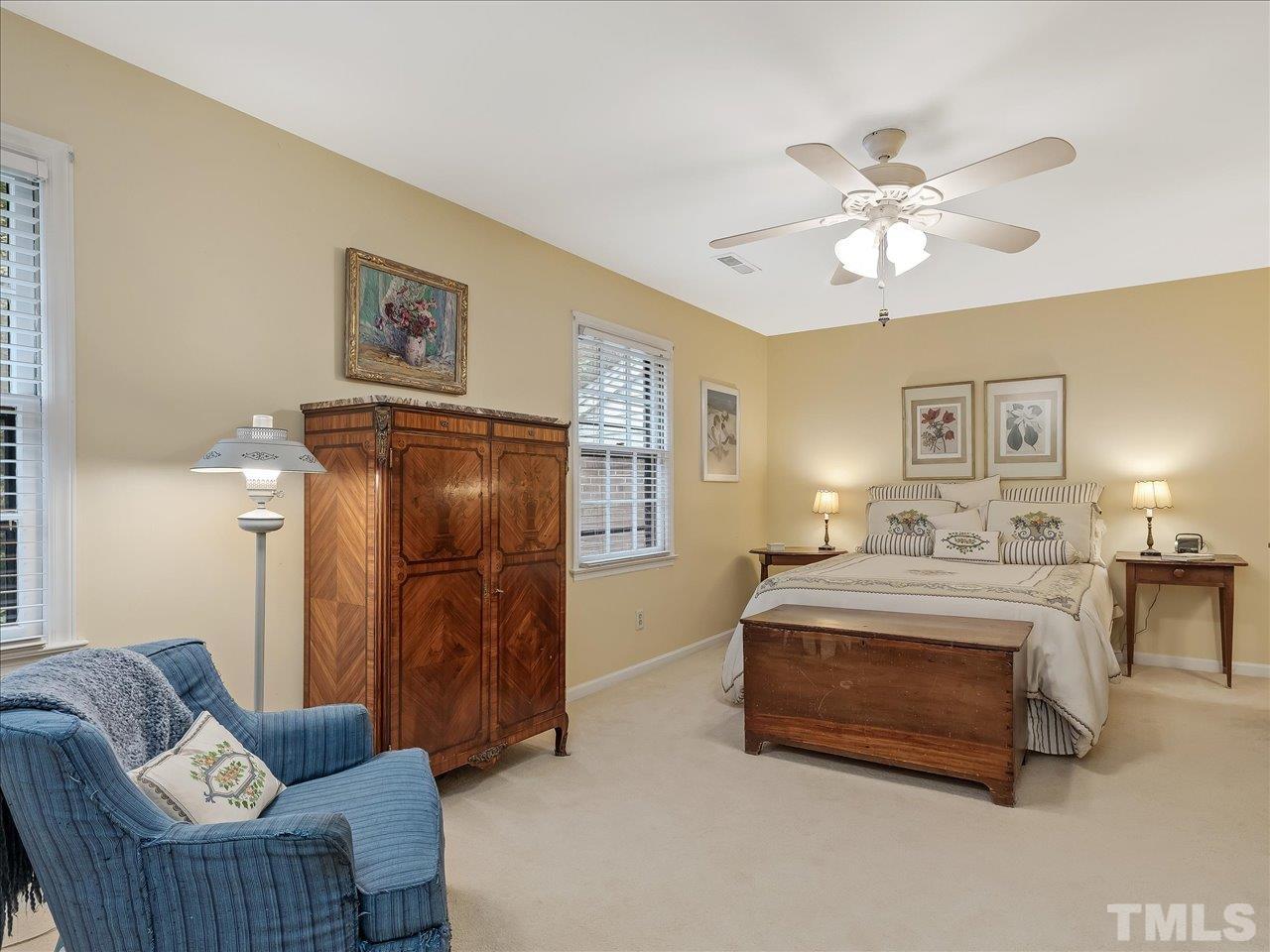 2868 Wycliff Road Raleigh, NC 27607 - Photo 12 of 28 a living room with furniture and a chandelier