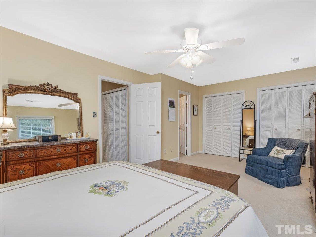 2868 Wycliff Road Raleigh, NC 27607 - Photo 13 of 28 a spacious bedroom with a bed and a dresser in it