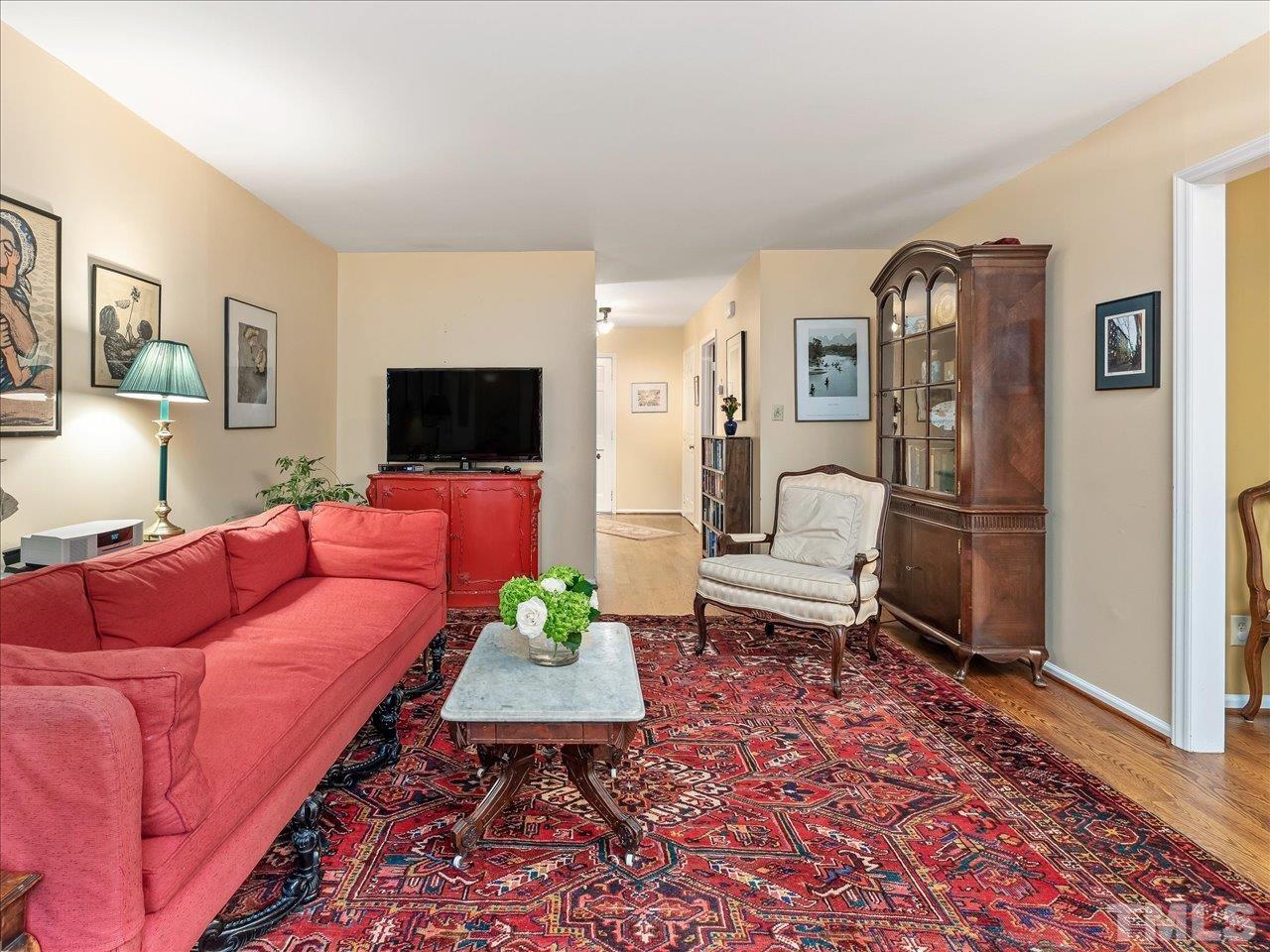 2868 Wycliff Road Raleigh, NC 27607 - Photo 6 of 28 a living room with furniture and a flat screen tv
