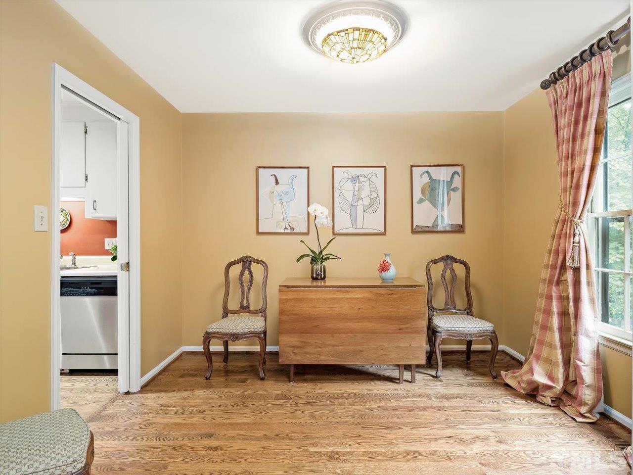 2868 Wycliff Road Raleigh, NC 27607 - Photo 8 of 28 a living room with furniture and a window