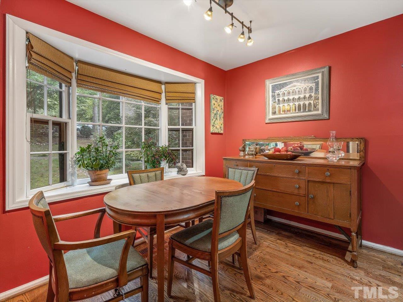 2868 Wycliff Road Raleigh, NC 27607 - Photo 10 of 28 a dining room with a wooden table and chairs