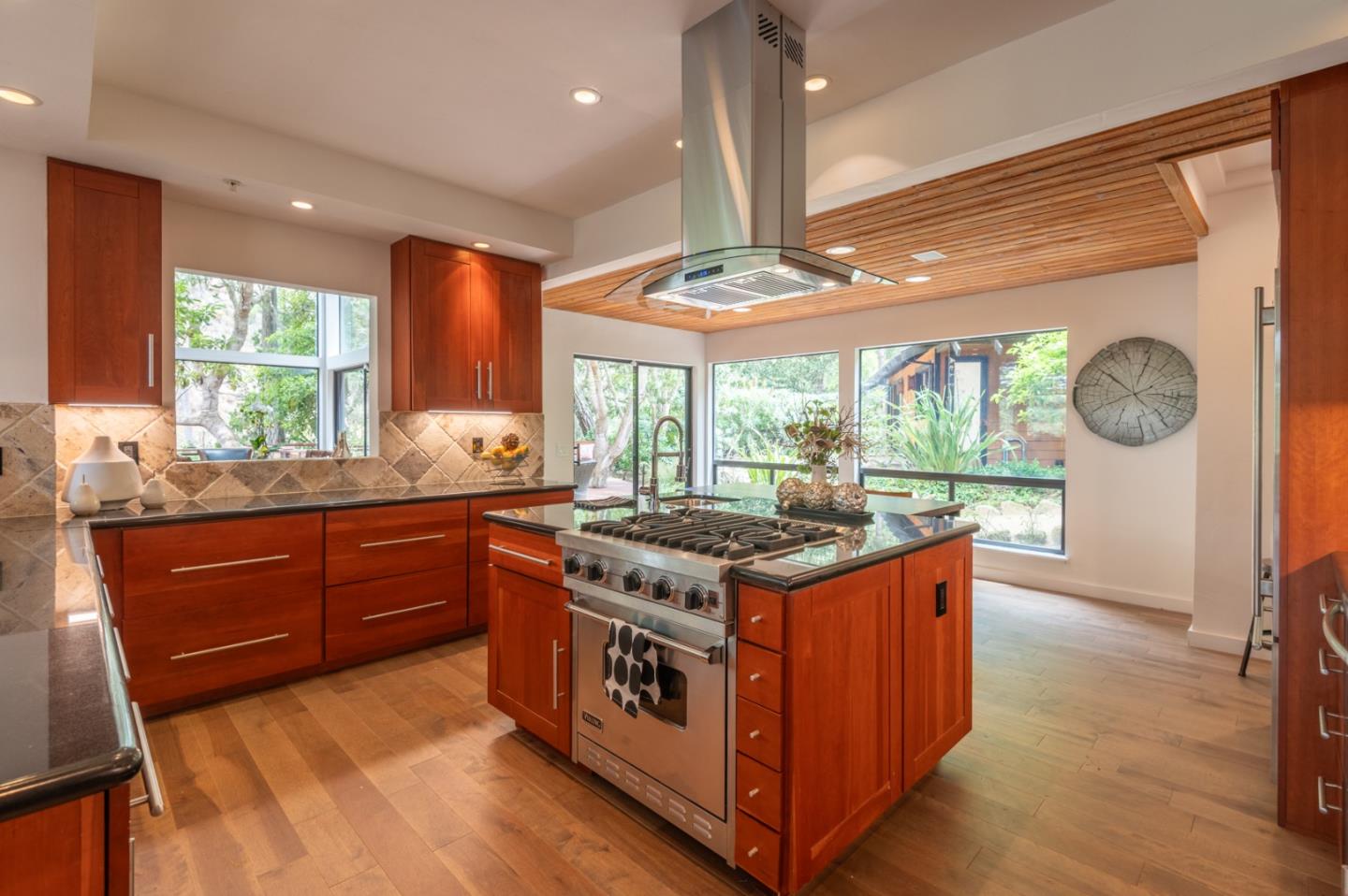 29705 Peter Pan Road Carmel, CA 93923 - Photo 14 of 51 a kitchen with stainless steel appliances granite countertop a stove a sink and a large window