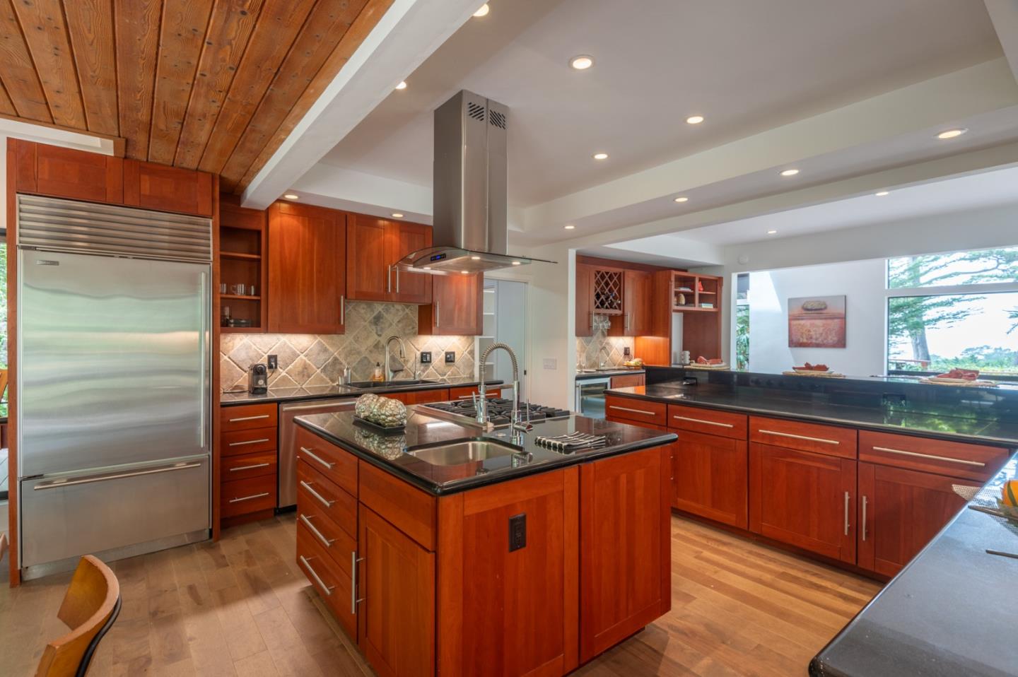 29705 Peter Pan Road Carmel, CA 93923 - Photo 16 of 51 a kitchen with stainless steel appliances granite countertop a stove a sink and a refrigerator
