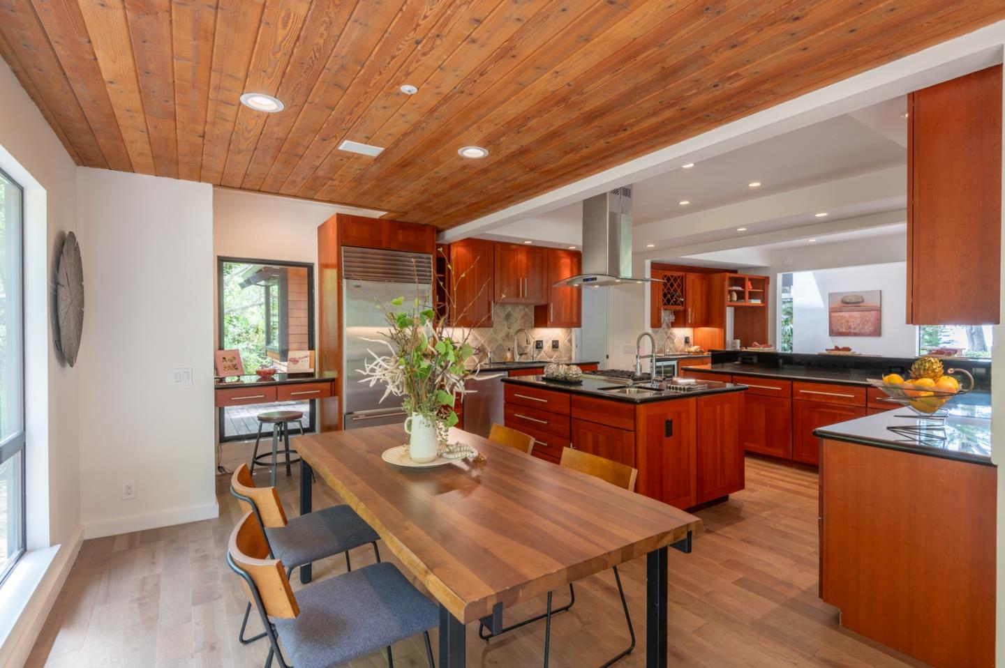 29705 Peter Pan Road Carmel, CA 93923 - Photo 17 of 51 a kitchen with stainless steel appliances granite countertop table chairs sink and cabinets